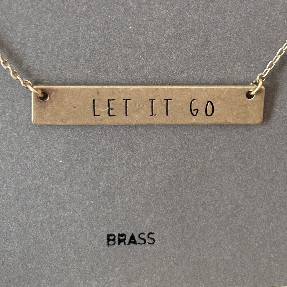 Sweet LET IT GO reminder necklace, gold finish.  Great gift!  NEVER WORN